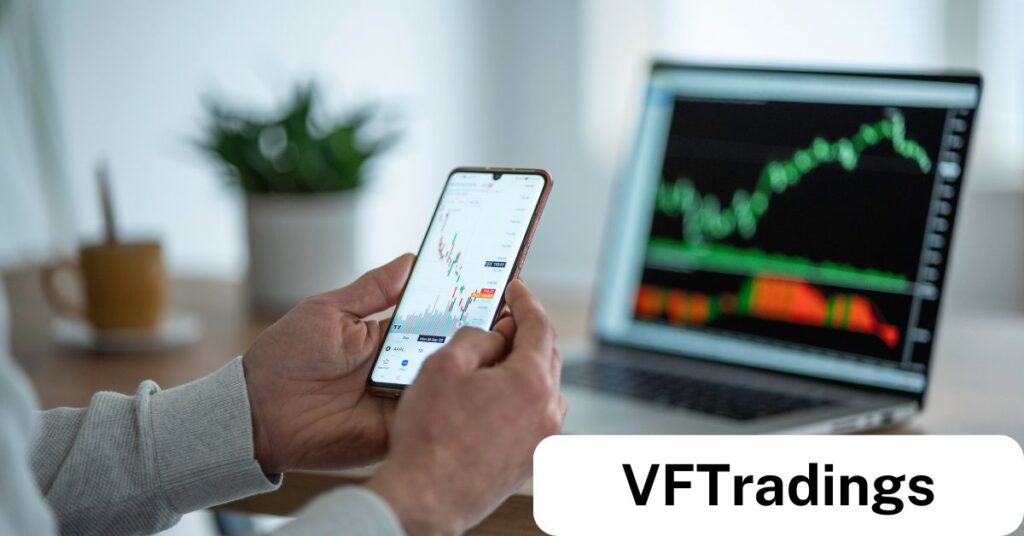 Trader analyzing market trends on a smartphone with trading charts displayed on a laptop, representing VFTradings' tools and resources for prop trading success.